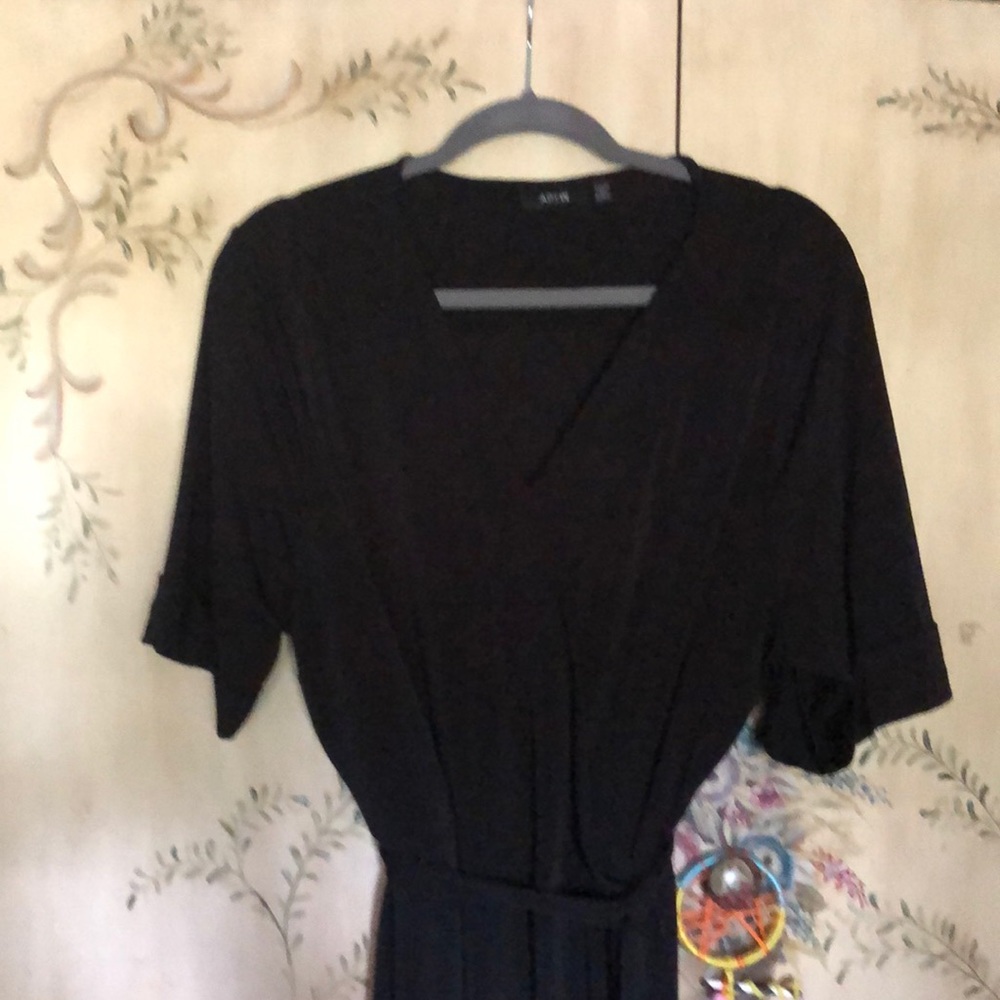 Knee length black dress.